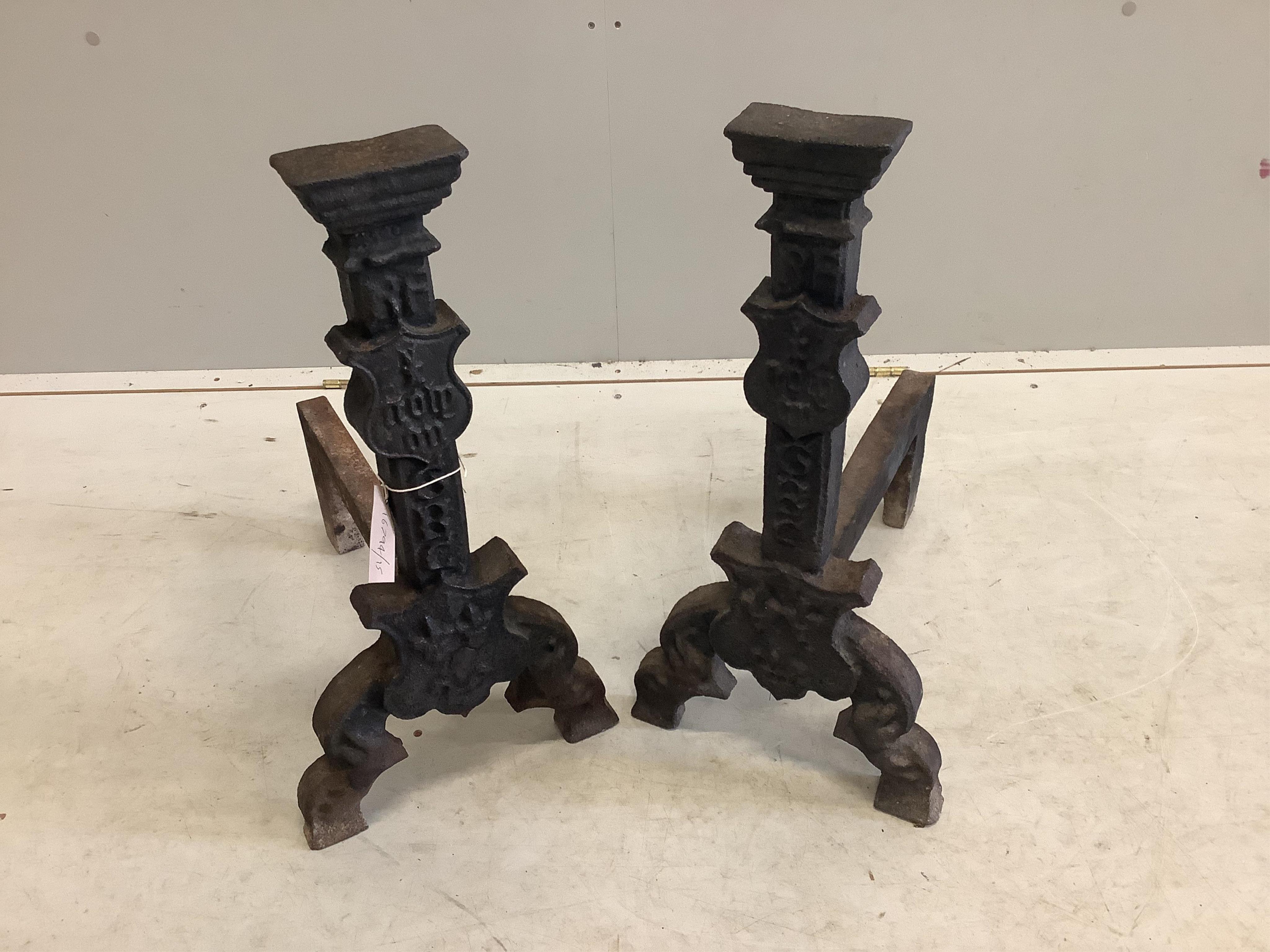 A pair of 16th century Elizabethan cast iron firedogs, depth 43cm, height 58cm. Condition - fair